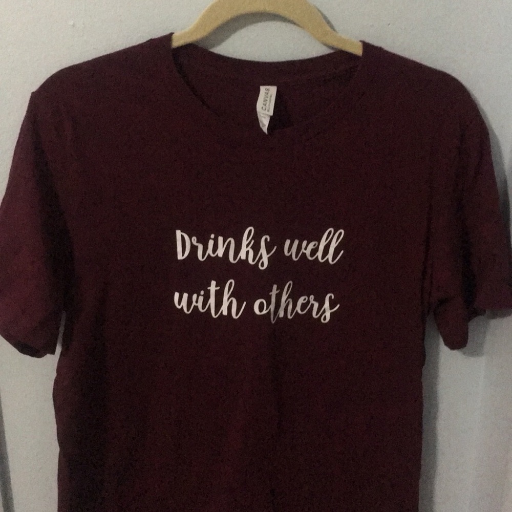 ‘Drinks well with others’ shirt